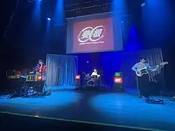 Ginger Root performing in San Diego in 2024. From left to right - Lew, Carney, Hovis.