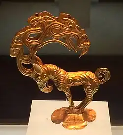 Gold stag with eagle's head, and ten further heads in the antlers. An object inspired by the art of the Siberian Altai mountain, possibly Pazyryk, unearthed at the site of Nalinggaotu, Shenmu County, near Xi'an, China.[103] Possibly from the "Hun people who lived in the prairie in Northern China". Dated to the 4th-3rd century BCE,[103] or Han dynasty period.[104] Shaanxi History Museum.[104]