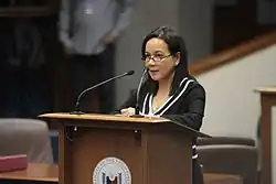Picture of Senator [[Grace Poe]] doing a speech in a podium about the Hello, Garci scandal in the ten-year anniversary.