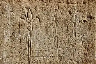 Graffito with ship and fleur-de-lis