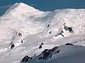 Great Needle Peak from Miziya Peak, with Sliven Peak and Atanasov Nunatak in the foreground, Huron Glacier with Kukeri Nunataks and Nestinari Nunataks in the middle, and Great Needle Peak and St.&nbsp;Ivan Rilski Col surmounting Plana Peak and Kardam Buttress in the background