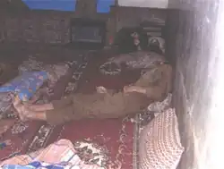 The bodies of Jaheed Abdul Hameed Hassan (43), Asmaa Salman Raseef (32) and her son Abdullah (4). Jaheed is lying in the foreground with his head against the wall.