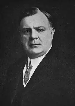 middle-aged man in business suit in full profile photograph