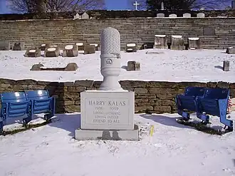 The gravesite of Harry Kalas, Philadelphia Phillies radio broadcaster, includes a microphone shaped tombstone and two pairs of seats from Veterans Stadium[37]