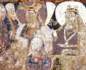 Probable Hepthalite rulers of Tokharistan, with single-lapel caftan and single-crescent crown, in the lateral row of dignitaries next to the Sun God.[35][36][32]