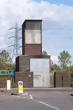 The aboveground Ferry Lane fan shaft building and emergency access point at Heron Island, approximately halfway between Blackhorse Road and Tottenham Hale stations
