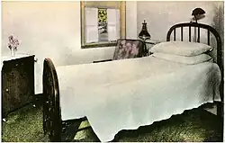 One medium-sized bed with dresser and window