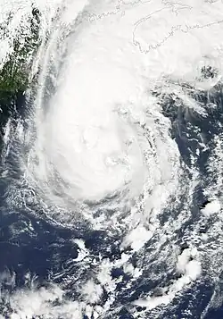A view of Hurricane Gustav from Space on September 11, 2002. The storm is located over the open ocean, and is approaching landfall in Canada. New England is seen on the left side of the image.
