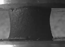 Buckycolumn with hyperboloid geometry on drying