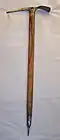A wooden handled ice axe from the mid-1970s Length: 75 cm (29+1⁄2 in) Weight: 840 g (29+1⁄2 oz)