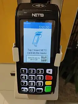 Payment screen on a Ingenico Desk 5000 terminal. This mode shown on the screen accepts payment input from a combination of NETS/NETS FlashPay/NETS QR without requiring separate selections.