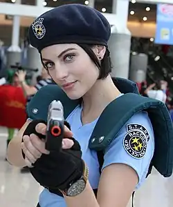 A photograph of Voth in a blue police uniform pointing a toy gun at the viewer.