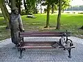 Sculpture bench in Kórnik with quotations from the poem