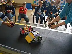 Two students using remote control K*bots in a UK Championship match.