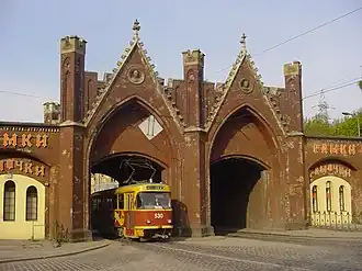 A Tatra T4 under the Brandenburg Gate, before 2012 when restoration work started on The Gate