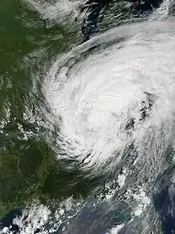 A satellite image of a tropical cyclone over the United States with cyclonically organized clouds