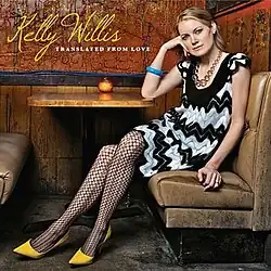 Willis seated, looking to the camera