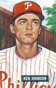 A baseball card image of a man in a white baseball jersey pinstriped with red and a red baseball cap with a white "P" on the front