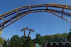 Steel Curtain's zero-g stall over Kennywood's lagoon. Another ride is in the background.