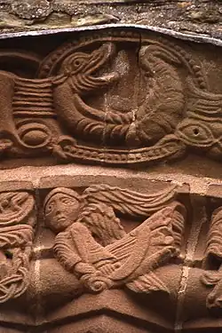 An angel appears in the centre of the arch above the south door.