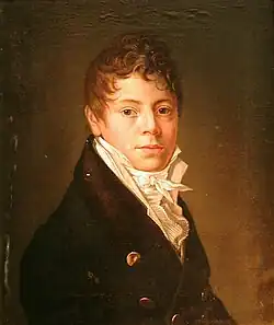 a painting of a young man with curly hair, pale visage and merry eyes; he wears a double-breasted brown coat and a white waiscoat with cravat