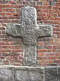Romanesque cross on the north wall of St. Bartholomew's Church