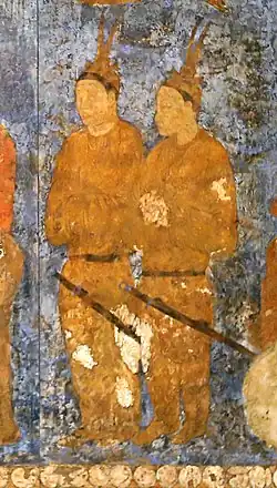 Goguryeo ambassadors during an audience with king Varkhuman of Samarkand. They are identified by the two feathers on top of their head.[24] 648-651 CE, Afrasiyab, Samarkand.[25][26]