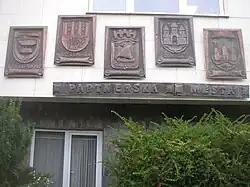 Insignia of twin towns on town hall in Kralupy nad Vltavou, Czech Republic