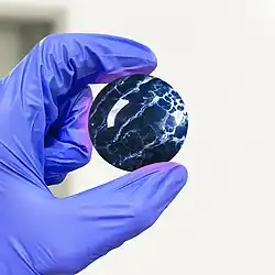 Sample of a spherically carved and polished fluorite via lapidary, a form commonly associated with decorative uses.