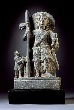 Kumara or Kartikeya with a Kushan devotee, c. 2nd century CE.