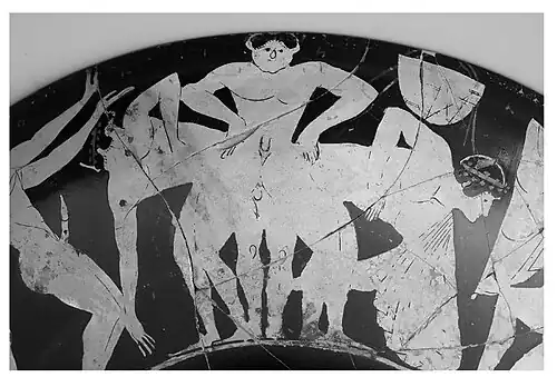 Two males bumping buttocks together. Two figures either side are dancing. Kylix. Attributed to the Manner of Epeleios Painter. 525 - 475 BCE