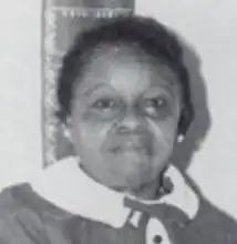 a somewhat grainy black and white headshot of a middle-aged black woman with short hair