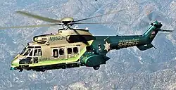 An L.A. County Sheriff's Department Super Puma flying a SAR mission