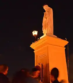 Effigy of Jesus Christ wearing the crown of thorns and purple robe.
