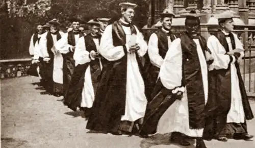 Long procession of mostly white clergymen in episcopal costume