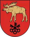 A coat of arms depicting a golden moose with large antlers and a protruding red tongue hovering over three black keys