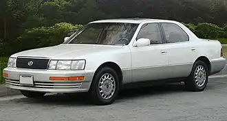 Front-three quarters view of a white sedan