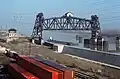 Lift span in raised position with towboat "Jim D" passing underneath