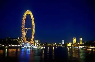 London Eye floodlit in gold in celebration of the Queen's Golden Jubilee