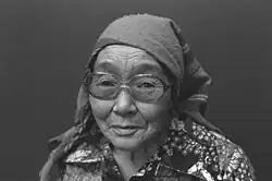 Black-and-white portrait of Lucy Qinnuayuak in glasses
