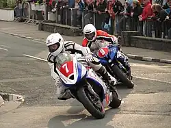Newcomers Race 'A' John Simpson (7) 675 cc Triumph & Kamil Holan (9) 600 cc Yamaha – Lap 1 Parliament Square, Ramsey Saturday 25 August 2012
