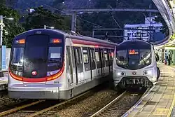 MTR Metro Cammell EMU (AC) seen next to its replacement, the Hyundai Rotem R-Train, at University Station in December 2021