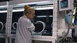 Supercapacitor test cell assembly in an argon dry chamber. Modern supercapacitors work with an organic electrolyte that must be protected from moisture. Therefore, the supercapacitor was filled with electrolyte in a dry chamber in high purity argon environment