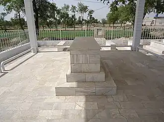 The grave of Major Tufail Muhammad Shaheed (Nishah e Haider) at his tomb in Tufailabad Graveyard.