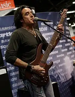 Mendoza performing in 2014