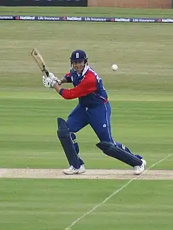 The popping crease is visible here, with England's Marcus Trescothick playing a shot that has involved him moving forward over his own crease to intercept the ball. In taking a successful run, he must ground his bat behind the corresponding crease at the other end of the pitch, and his batting partner must in turn ground himself behind Trescothick's crease.[6] Should Trescothick have ventured beyond his crease in playing his shot, he risked being stumped.[1][6]