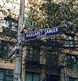 Photo of a street sign in New York, showing the name "Margaret Sanger Square"