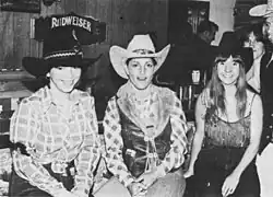 Roberta Williams and her two colleagues all wearing cowboy hats