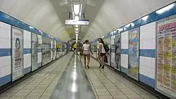 A view along a wide passage with a semi-circular ceiling