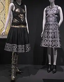 Two black and white patterned minidresses. Left dress has gold accents.